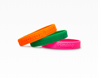 Three embossed rubber wristbands.